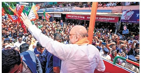 Union Home Minister Amit Shah during a roadshow in Kozhikode on Sunday