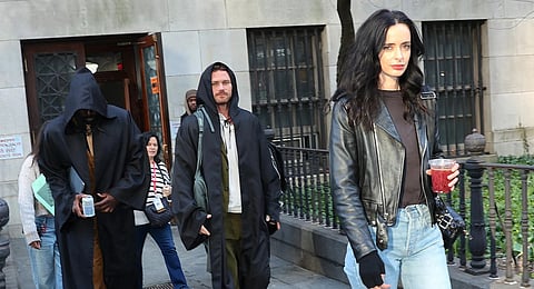 Krysten Ritter with Mike Colter and Finn Jones on Daredevil: Born Again set