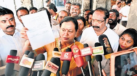 DMDK’s Premalatha Vijayakanth addressing reporters at Arunachaleswarar temple in Tiruvannamalai on Sunday.