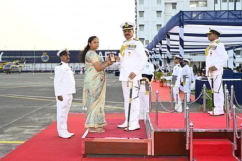 Raushani, wife of Deepak Kumar (inset), receives the Padak