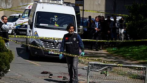 Police officials gather near bloodstained clothing outside The Israeli Consulate in Istanbul on April 7, 2026, following a shootout between gunmen and police.
One gunman was killed and two others were wounded in a shootout with police outside the Israeli consulate in Istanbul, the local governor said, adding two officers were lightly wounded.