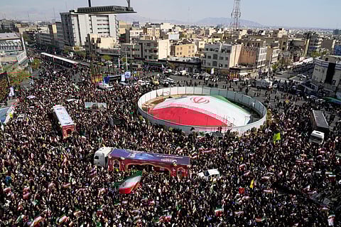 Mourners gather during a funeral procession for Alireza Tangsiri, head of Iran's Islamic Revolutionary Guard Corps Navy, and others killed in Israeli strikes in late March, in Tehran, Iran, Wednesday, April 1, 2026.