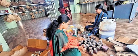 Women package the wild honey procured by Koraga tribals