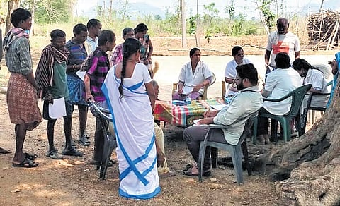 A team of healthcare professionals including a doctor, a nurse and a pharmacist conducts a medical camp at Komarada mandal