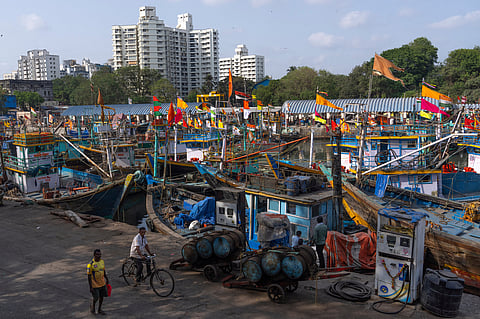 Fishing boats remain anchored at Sassoon Dock beside a cooperative diesel pump that is shut due to rising bulk fuel prices in Mumbai, India, Tuesday, April 7, 2026.