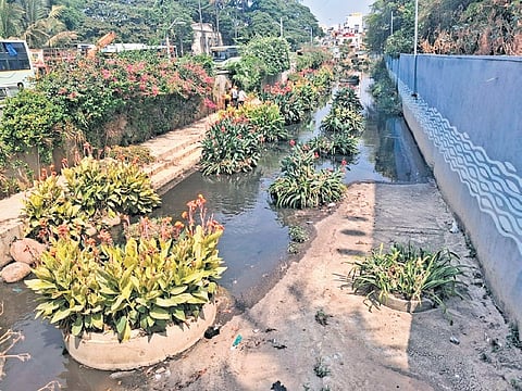 The K-100 water channel resembles a drain due to inflow of sewage