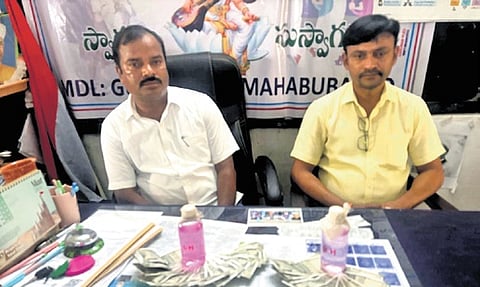 ZPHS headmaster J Ravi Kumar and school assistant G Chandramouli.