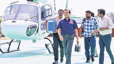 V R Rajesh, Dr Jeevesh Thomas, Basil and Dr Jo Joseph of Lisie Hospital with the heart of Jayi Jayakumar.