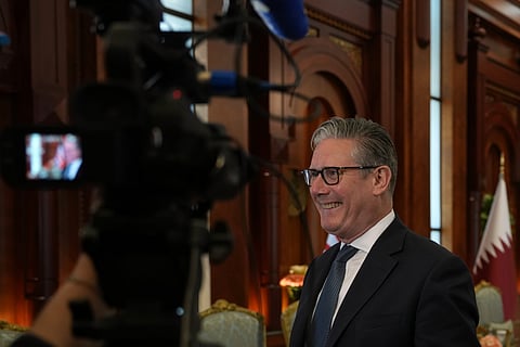 Britain's Prime Minister Keir Starmer speaks to the media at the airport in Doha, Qatar, Friday, April 10, 2026 after his three day visit to the Gulf region.