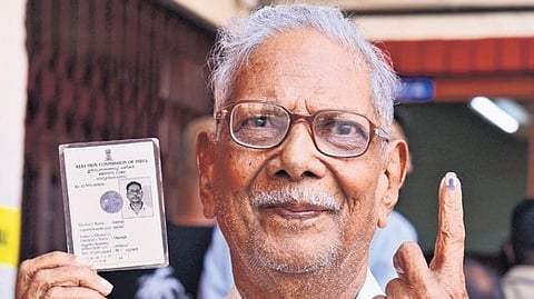 N O George showing his inked finger after casting his vote at Matha Nagar Public School in Kochi.