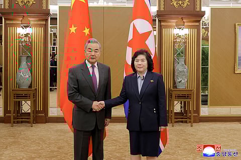 This picture taken on April 9, 2026 and released by North Korea's official Korean Central News Agency (KCNA) on April 10, 2026 shows Chinese Foreign Minister Wang Yi (L) shaking hands with North Korean Foreign Minister Choe Son Hui at the Geumsusan Guesthouse in Pyongyang.