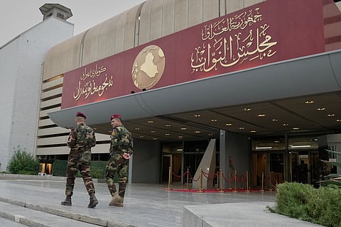 Guards prepare for the arrival of Parliament members at the parliament building hall to elect the President of the Republic, in Baghdad, Iraq, Saturday, April11, 2026.