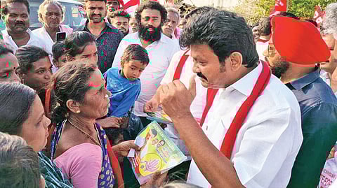 Thalli MLA T Ramachandran interacts with voters during an election campaign at Bettamugilalam village in Krishnagiri district on Saturday.