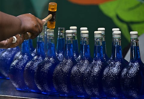 Women bottle the original Curacao liquor at The Curacao Liqueur Distillery in Willemstad, Curacao, in the Dutch Caribbean, on April 9, 2026.