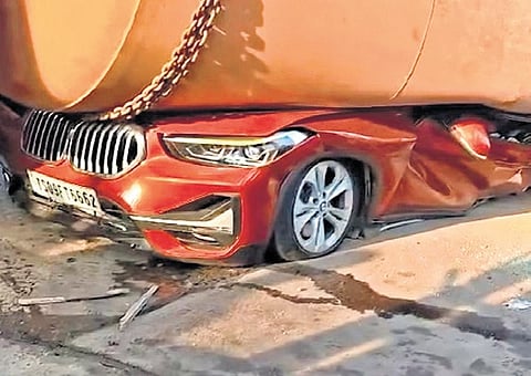 The BMW car which was crushed under cement-laden truck