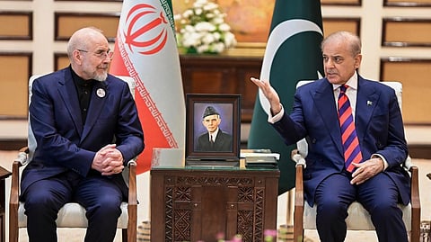 In this photo released by the Pakistan Prime Minister Office, Iran's Parliament Speaker Mohammad Bagher Ghalibaf, left, meets with hand with Pakistani Prime Minister Shehbaz Sharif, in Islamabad, Pakistan, Saturday, April 11, 2026.