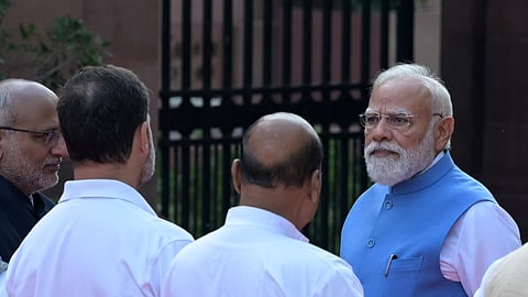 Prime Minister Narendra Modi with Congress MP and Lok Sabha LoP Rahul Gandhi and Vice-President CP Radhakrishnan during the 200th birth anniversary celebration of Mahatma Jyotiba Phule, at the Parliament premises, in New Delhi on Saturday. Union Minister JP Nadda are also present.