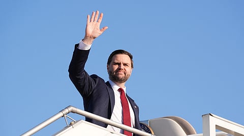 US Vice President JD Vance waves as he boards Air Force Two after attending talks on Iran in Islamabad on April 12, 2026.