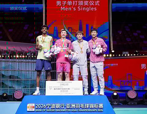 Ayush Shetty (L) poses with the medal with other medal winners at the Badminton Asia Championships