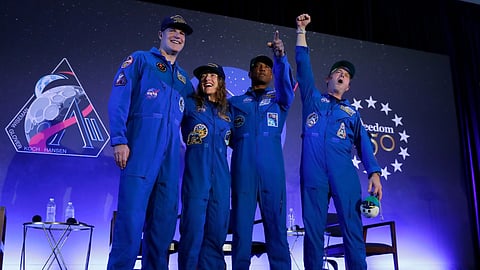 The Artemis II crew, from left, Jeremy Hansen, Christina Koch, Victor Glover and Reid Wiseman come to the center stage at the end of a crew return event Saturday, April 11, 2026, at Ellington Field in Houston.