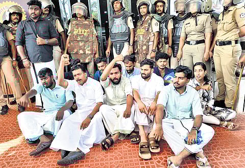 Protesters at Anjarakandy Dental College in Kannur on Monday