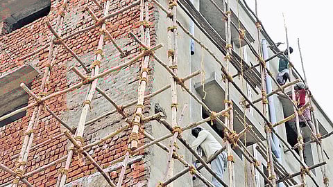 Labourers working at a construction site in Tiruchy.
