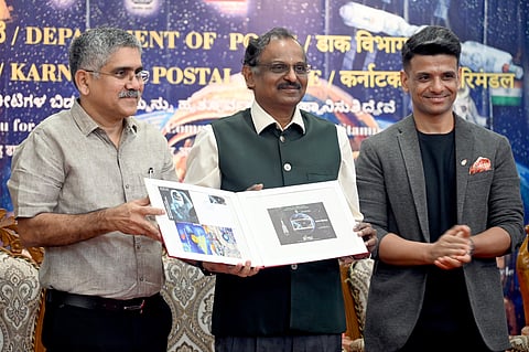 ISRO Chairman Dr V Narayanan Unveils the stamp with Group Captaion Shubhanshu Shukla K Praksh Chief Postmaster General and others during the relesae of Commemorative postage Stamp on IndiasHuman Space Programme at Genral post office in Bengaluru on Sunday