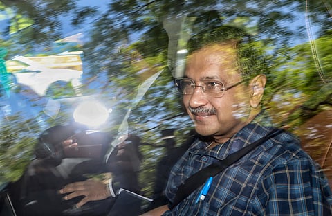 AAP National Convener Arvind Kejriwal arrives at the Delhi High Court for a hearing in a case related to the excise policy
