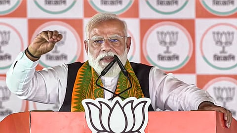 Prime Minister Narendra Modi speaks during a public meeting ahead of the West Bengal Assembly elections, in Siliguri, West Bengal.
