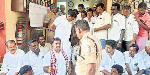 AIADMK functionaries led by Anaicut candidate D Velazhagan staging a protest in front of the police station on Monday