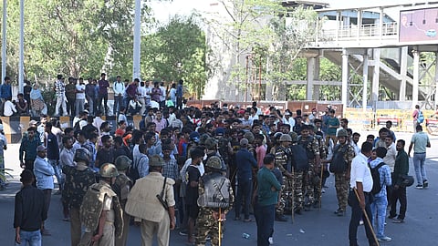Factory workers during a protest demanding a hike in wages, in Noida, Gautam Buddh Nagar district near Metro Station NSEZ Uttar Pradesh, Monday, April 13, 2026.