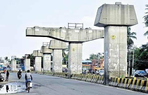To regulate freight flow on the upcoming Maduravoyal elevated corridor, it is crucial to construct the truck holding yard.