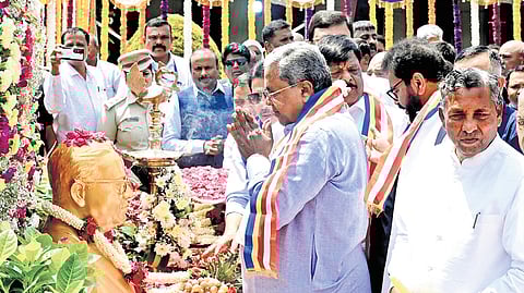 CM Siddaramaiah pays tribute to Dr BR Ambedkar on his 135th birth anniversary at Vidhana Soudha on Tuesday.