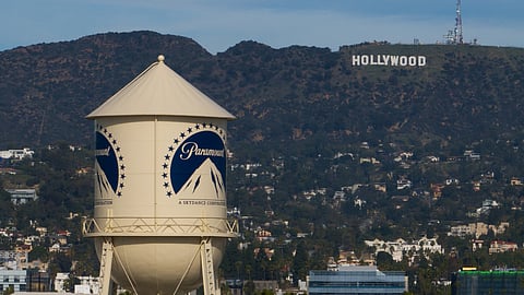 The Paramount Pictures water tower is seen in Los Angeles, Dec. 18, 2025, with the Hollywood sign in the distance.