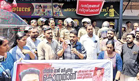DYFI workers protest in front of the clinic linked to Dr M K Ram at Dharmadam in Kannur on Tuesday. Ram, an HoD at Kannur Dental College in Anjarakandy, was suspended following the death of first-year student Nithin Raj