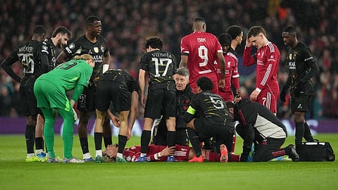 Liverpool's Hugo Ekitike lies injured during the Champions League quarterfinal second leg soccer match between Liverpool and Paris Saint-Germain in Liverpool, England, Tuesday, April 14, 2026.