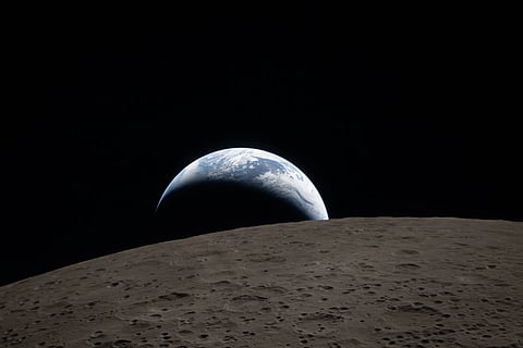 In this image provided by NASA, The Artemis II crew captured this view of an Earthset on Monday, April 6, 2026, as they flew around the Moon.