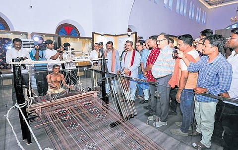 Union Minister Pradhan and others going around the museum on Wednesday