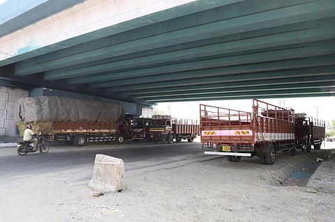 Motorists commuting on the western ring road have raised concerns over the large multi-axle trucks that have been parked under the bridge