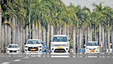 A shimmering mirage makes vehicles on a sun-scorched Shamshabad road
appear distorted as an intense heatwave grips Hyderabad.
