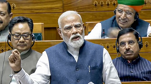 Prime Minister Narendra Modi speaks in the Lok Sabha during the special session of Parliament in New Delhi, Thursday, April 16, 2026. Union Ministers Kiren Rijiju, Arjun Ram Meghwal and Pralhad Joshi are also seen.