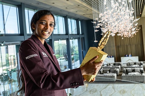 R Vaishali with the trophy