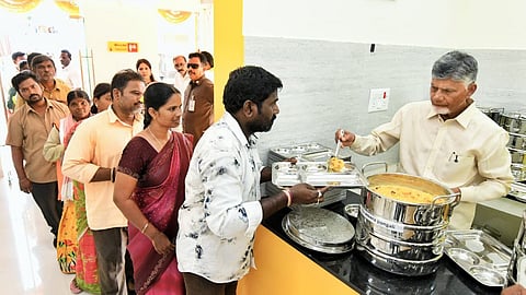 CM Nara Chandrababu Naidu serves food after inaugurating Anna Canteen at Dharanikota in Pedakurapadu of Palnadu district on Wednesday.