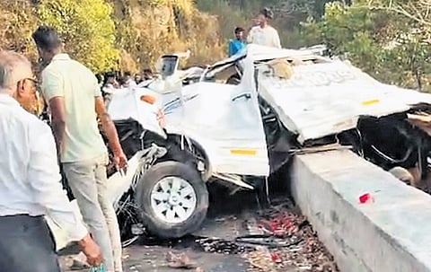 The mangled remains of the van that fell off a hairpin bend on Valparai-Pollachi Ghat Road on Friday