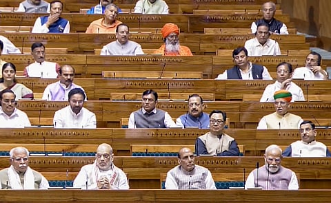 Prime Minister Narendra Modi, Union Home Minister Amit Shah, Defence Minister Rajnath Singh, and other members in the Lok Sabha during the Special session of Parliament, in New Delhi, Saturday, April 18, 2026.