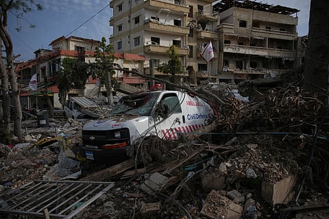 An ambulance belonging to Hezbollah's health unit lies amid the rubble of a medical center destroyed in an Israeli airstrike in JIbchit, Southern Lebanon, Friday, April 17, 2026.
