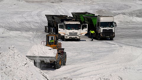 A front-end loader transports phosphogypsum in Phalaborwa, South Africa, Monday, Sept. 8, 2025.