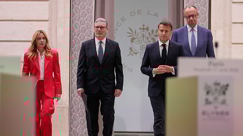 From left, Italian Premier Giorgia Meloni, Britain's Prime Minister Keir Starmer, France's President Emmanuel Macron and German Chancellor Friedrich Merz arrive to give a statement after an international summit to push forward efforts to reopen the Strait of Hormuz at the Elysee Palace in Paris, France, Friday, April 17, 2026.