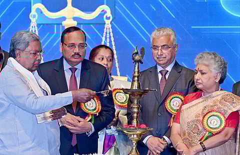 Chief Justice of India justice Surya Kant with Chief Minister Siddaramaiah, Supreme Court Judges justice BV Nagarathna and justice Aravind Kumar and others during the 22nd Biennial State Level Conference of Judicial Officers on "Reimagining the Judiciary in the Era of Artificial Intelligence" in Bengaluru on Saturday.
