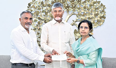 Nara Bhuvaneswari, wife of CM Nara Chandrababu Naidu, presenting a cheque for Rs 76 lakh to the CEO of Anna Canteens on Sunday